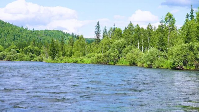 Middle Siberia, Krasnoyarsk Territory. Hilly (coniform hill) river bank. Taiga mixed forests