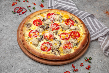 Tasty hot italian pizza with Mozzarella, chicken, corn, mushrooms and Tomato Sauce on a beige textured background. Pizzeria menu. 