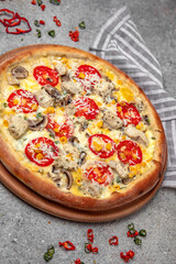 Tasty hot italian pizza with Mozzarella, chicken, corn, mushrooms and Tomato Sauce on a beige textured background. Pizzeria menu. 
