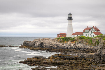 Fototapeta na wymiar The rocks surrounding a Maine lighthouse