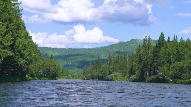Middle Siberia, Krasnoyarsk Territory. Hilly (coniform hill) river bank. Taiga mixed forests