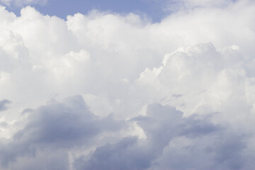 blue sky with fluffy clouds in summer time