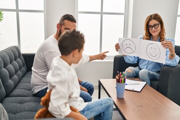 Family having psychology session looking emotion emoji draw at psychology center