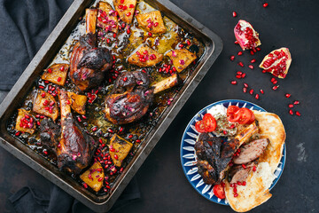 Traditional braised slow cooked Australian lamb shank with pineapple and pomegranate served as top...
