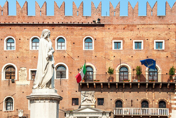Piazza dei Signori in Verona, city square with Italian poet Dante Alighieri's statue and the medieval Podestà Palace, Verona, Veneto region, Italy
