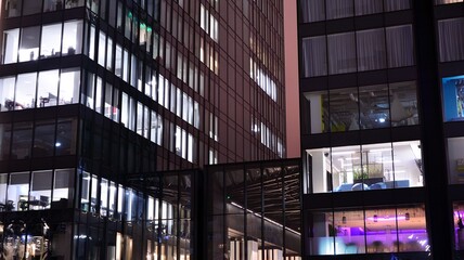 Office building at night, building facade with glass and lights. View with illuminated modern skyscraper. © Grand Warszawski