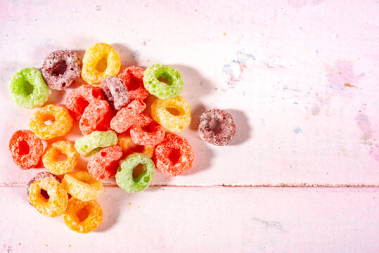 Flatlay Of Colourful Candy On Light Pink Wood  Background With Space For Text