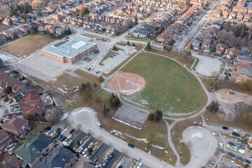Empty Toronto  school closed because of Covid with an empty baseball field 