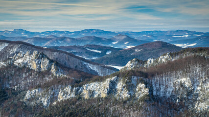 Snowy winter landscape with rocky mountain range. National Nature Reserve Sulov Rocks, Slovakia, Europe.