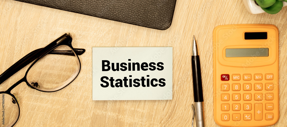 Poster text business statistics on sticker on notepad on diagram background.