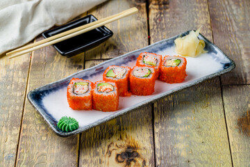California roll with crab on wooden table