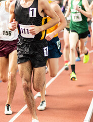 Runners running an indoor mile race