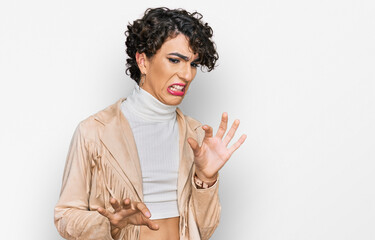 Handsome man wearing make up and woman clothes disgusted expression, displeased and fearful doing disgust face because aversion reaction.