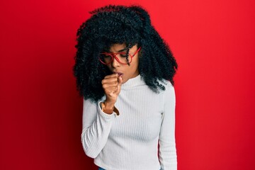 Fototapeta na wymiar African american woman with afro hair wearing casual sweater and glasses feeling unwell and coughing as symptom for cold or bronchitis. health care concept.