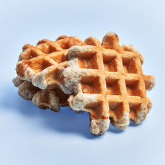  Bunch of delicious waffles over blue background