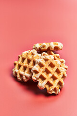  Bunch of delicious waffles over red background