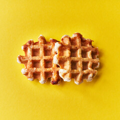 Two delicious waffles over yellow background