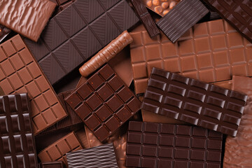 Pile milk and dark chocolate bar. Sweet food background, top view.