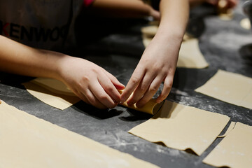 children prepare homemade dumplings and ravioli