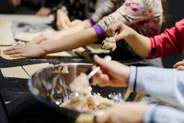 Obraz na płótnie Canvas children prepare homemade dumplings and ravioli