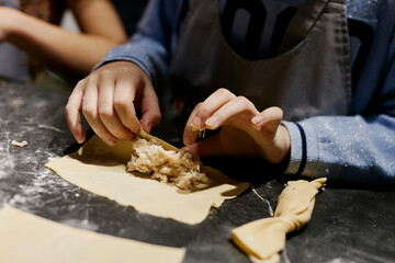 children prepare homemade dumplings and ravioli