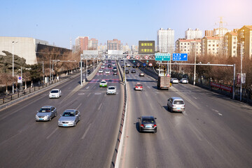 Fast vehicles in Chinese highway during sunny day