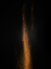 Stylish futuristic composition - gold dust on a black background. Levitation. Minimalism. There are...