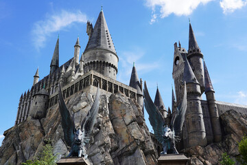 Naklejka premium Orlando, USA – July 17, 2021: Hogwarts Castle at The Wizarding World Of Harry Potter in Adventure Island of Universal Studios Orlando. Universal Studios Orlando is a theme park in Orlando.