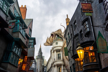 Fototapeta premium Orlando, USA – July 17, 2021: The Dragon at the Gringotts Bank in Diagon Alley at The Wizarding World Of Harry Potter in Universal Studio Orlando. Universal Studio Orland is a theme park in Orlando.