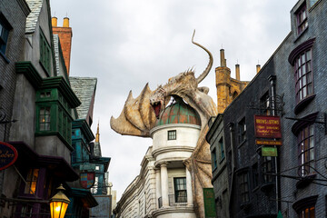 Fototapeta premium Orlando, USA – July 17, 2021: The Dragon at the Gringotts Bank in Diagon Alley at The Wizarding World Of Harry Potter in Universal Studio Orlando. Universal Studio Orland is a theme park in Orlando.