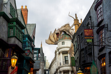 Naklejka premium Orlando, USA – July 17, 2021: The Dragon at the Gringotts Bank in Diagon Alley at The Wizarding World Of Harry Potter in Universal Studio Orlando. Universal Studio Orland is a theme park in Orlando.