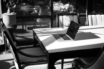 Working laptop in the interior of the apartment