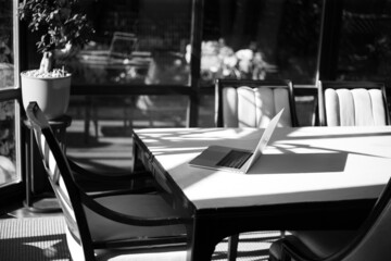 Laptop on the table in the interior of the apartment