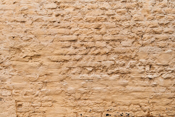  Painted yellow brick wall surface background