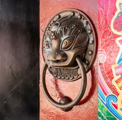 traditional chinese temple with guardian door knockers