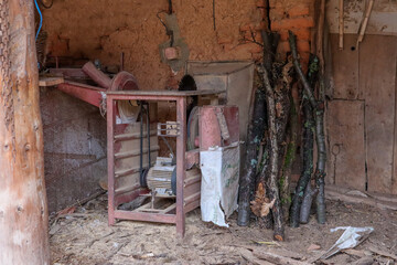 A shed in the village with an old saw for cutting wood and other rural items