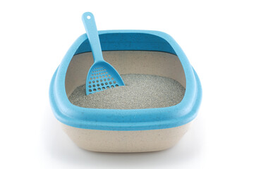 Front view of a cat litter tray with scoop on white