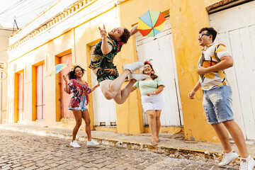Brazilian Carnival. Group of friends dancing Frevo during street carnival block