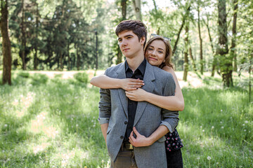 Happy couple on a walk in spring nature. The lifestyle of people of happiness.