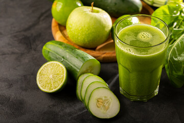 Healthy detox smoothie with cucumber, broccoli, green apple, kale and green grapes. Detox drink.