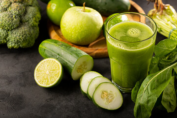Healthy detox smoothie with cucumber, broccoli, green apple, kale and green grapes. Detox drink.