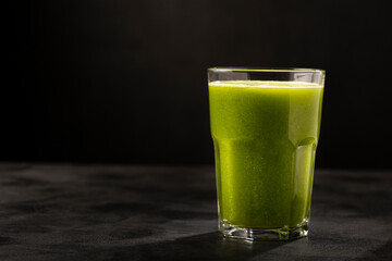 Healthy detox smoothie in glass cup. Detox drink.