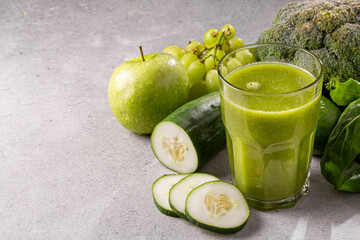 Healthy detox smoothie with cucumber, broccoli, green apple, kale and green grapes. Detox drink.