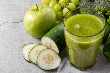 Healthy detox smoothie with cucumber, broccoli, green apple, kale and green grapes. Detox drink.