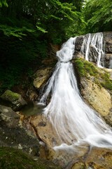 Fototapeta na wymiar trekking around waterfall in summer