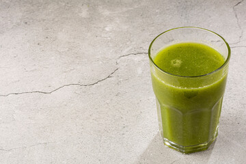 Healthy detox smoothie in glass cup. Detox drink.