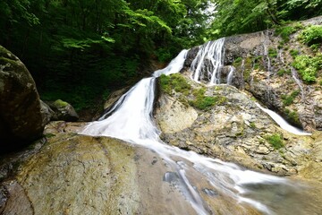 trekking around waterfall in summer