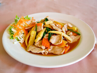 Thai cuisine, Baby corn and pork stir fried, close up