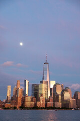 Fototapeta premium New York city lower Manhattan skyline at twilight with moon