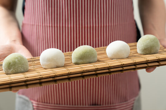 Japanese matcha and original flavor mochi or daifuku dessert on a white serving plate